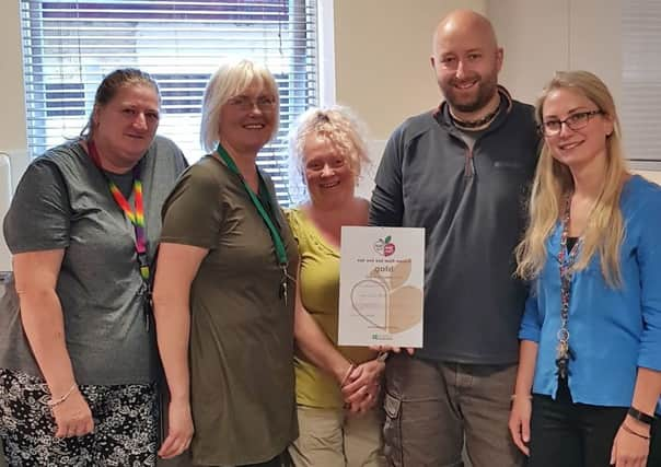 Members of Fleetwood House's winning team Susan Goodchild, Inga Overko, Gina Vaughan, Michal Bratek and Ruta Nalivaikiene, with their gold award certificate