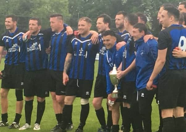 Hollington United celebrate after winning the Macron East Sussex Football League title.