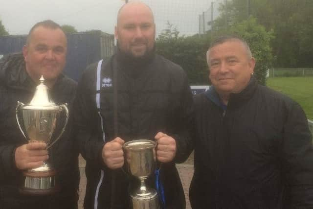 Hollington United Football Club assistant manager Andy Thomson, manager Scott Price and president Tim Martin, of the club's main sponsor Martin & Bowles.