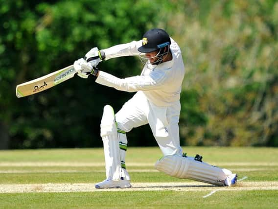 Sam Whiteman hits out during his 130 against Horsham