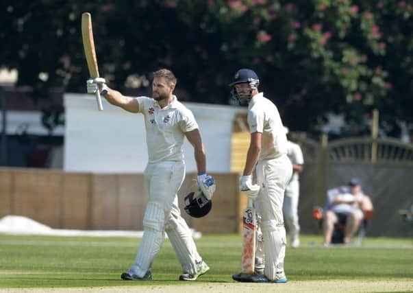 Jordan Turner celebrates his century against Hastings