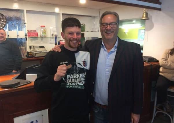 AFC Uckfield chairman Tom Parker (right) presenting Craig Norman with the 2017-18 Supporters Player of Year Award