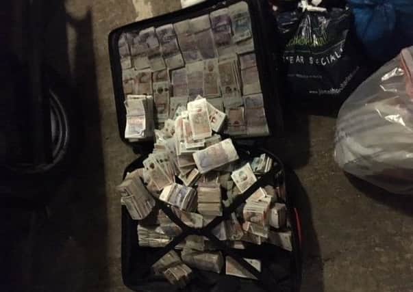 HMRC photo of cash found during raid in Essex on May 31