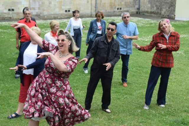 Dawn Gracie leads the dancing on the Cathedral Green