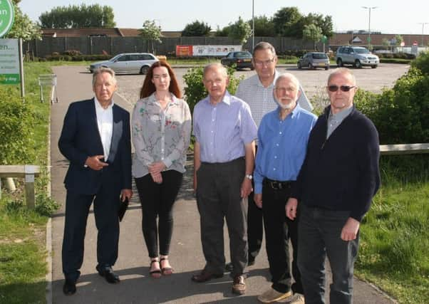 Roger Elkins, far left, and residents by the site where the proposed ASDA petrol station would be. Photo by Derek Martin Photography