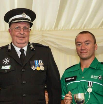 Carl Bennett with Trevor Moss, district manager at St John Ambulance