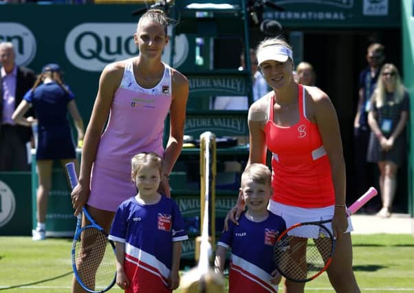 Eva Couchman-Seal and Tyler Willard with Karolina Pliskova and Anastasia Pavlyuchenkova on Centre Court at Devonshire Park. Photo by Charlie Crowhurst/Getty Images for LTA