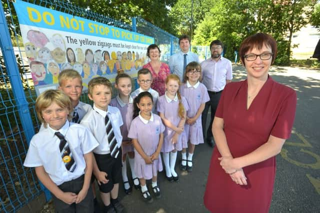 Ark Blacklands: Natalie Rankin, Head of School at Ark Blacklands Primary Academy (front) with pupils and (back, from left) teacher Felicity Parker, Daniel Clarke from East Sussex County Councils parking team and Jeremy Wassell from NSL SUS-180407-150247001