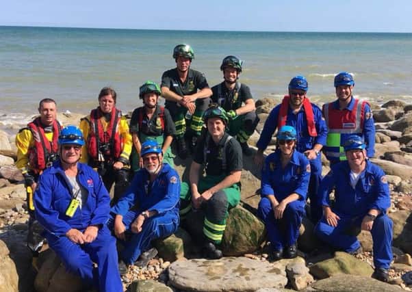 SECAmb HART Hastings Coastguard Rescue team and RNLI Hastings Lifeboat Station crew members