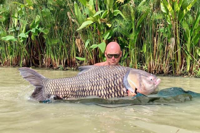 Jake with his monster 180lb Siamese carp SUS-180716-143154001