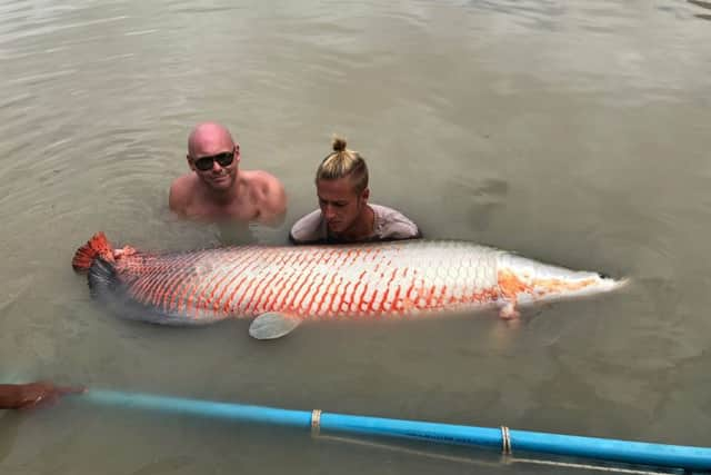 Jake holding an arapaima which he estimates weighed between 220lb and 250lb SUS-180716-143143001