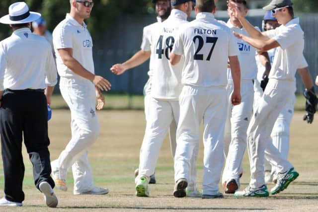 Worthing celebrate a wicket in the win over Slinfold. Picture by Stephen Goodger