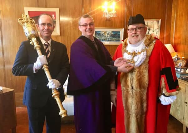 Councillor Alex Harman handing over the mayoralty to councillor Paul Baker at the Worthing Borough Council annual meeting