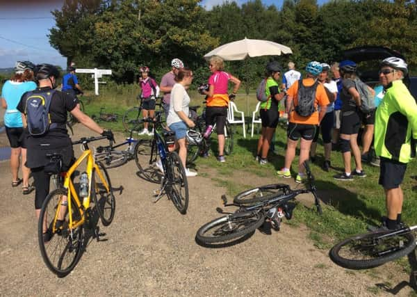 Taking a break during a previous 1066 Country Ride SUS-180608-152036001