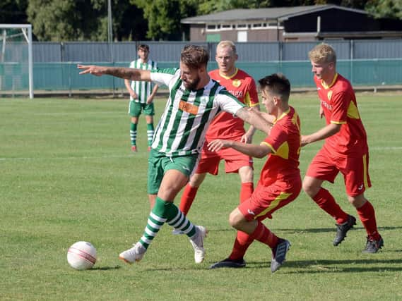 Scorer Tiago Andrade holds off Newhaven at Oaklands Park / Picture by Kate Shemilt