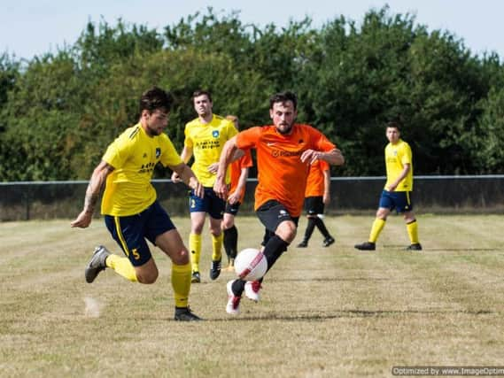 Sidlesham, in yellow, take on Mile Oak / Picture by David Jeffery