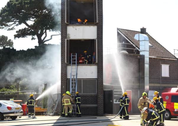 Work with the technical rescue team to demonstrate a rescue from a height