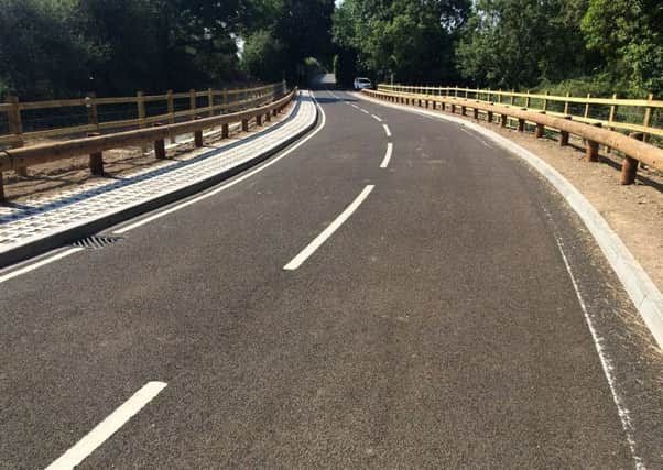 The new Wineham Lane bridge, showing green engineering elements, such as grasscrete on the left of the picture, which will green up over time, plus sustainable timber fencing