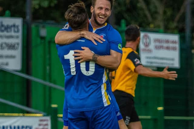 Charlie Walker celebrates with goalscorer Llord Dawes. Picture by Jamie Evans