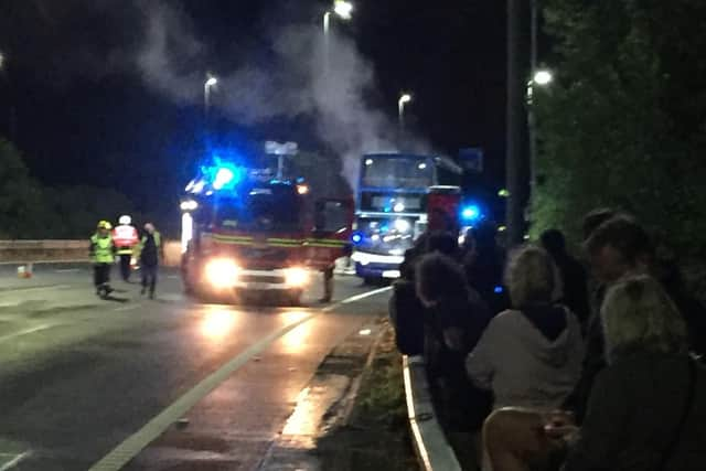 A bus full of festivalgoers burst into flames on the M275 last night. Picture: Mark Waldron