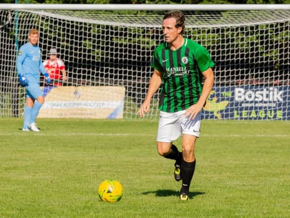 Gary Charman in action against Whitehawk. Picture by Chris Neal