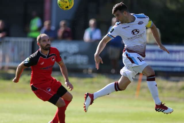 Jack Dixon gets his head to the ball against Phoenix Sports. Picture courtesy Scott White