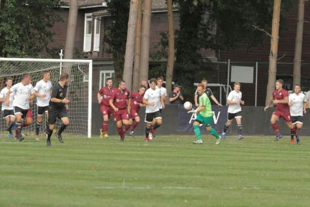 Action from Loxwood v Alfold in the Peter Bentley Challenge Cup. Picture by Ray Merridew.