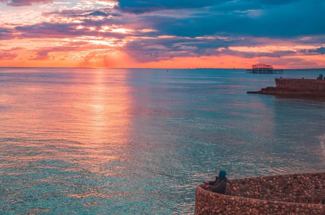 A fisherman enjoying the sunset at Brighton seafront (Photograph: Marius Comanescu)