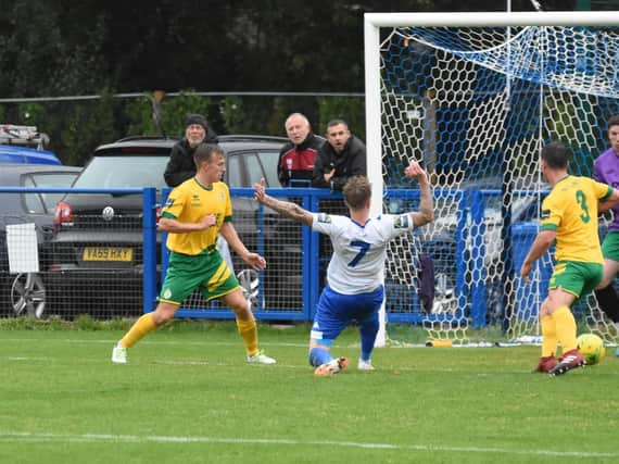 Callum Saunders pokes the ball home to open the scoring. Picture by Grahame Lehkyj