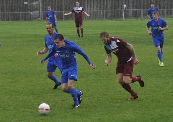 Little Common full-back Ryan Paul tracks back in pursuit of a Broadbridge Heath opponent. Pictures by Simon Newstead