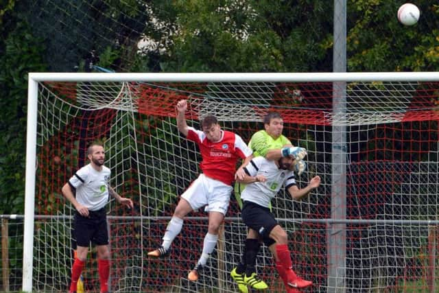 YM's Aaron Jeal punches away. Picture by Peter Cripps.