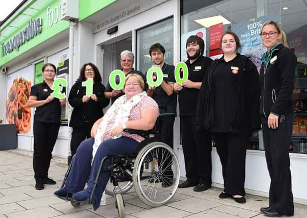 Martine Walters with staff at Southern Co-op's Ferring store