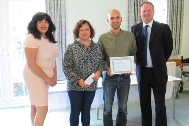 The Kabaivanov family collecting their award for best family allotment SUS-180928-113143001