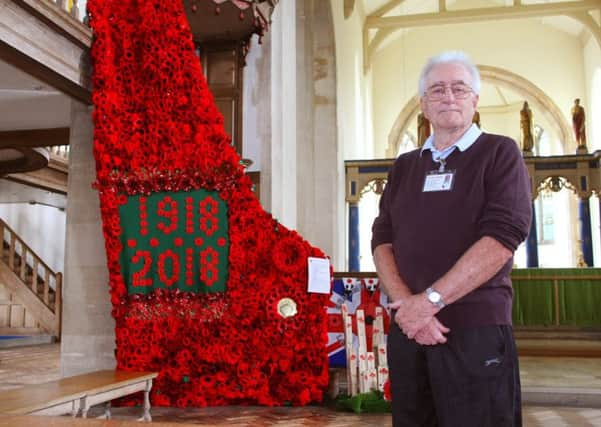 Terry Elderfield, deputy Poppy Appeal organiser, with the cascade at St Mary's Church in Littlehampton. Photo by Derek Martin DM18100036a