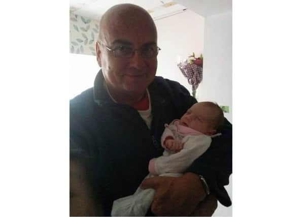 Clifford Marsh with his granddaughter Scarlett, who passed away aged 7 months and rests in Durrington Cemetery SUS-180110-130442001