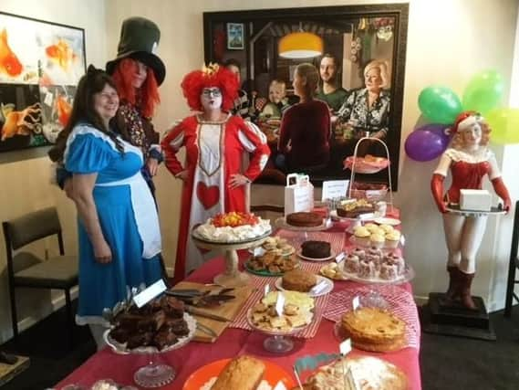 Secretary Michelle Jones dressed up as the Queen of Hearts, secretary Lesley Shine as Alice and legal apprentice Edward Whitting as the Mad Hatter at A.R. Brown & Co in Worthing