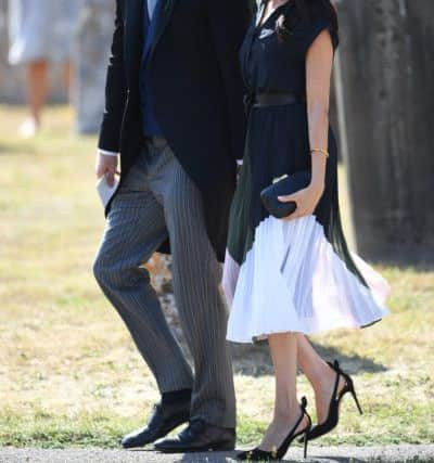 The Duke and Duchess of Sussex outside St Mary the Virgin Church in Frensham, Surrey, after attending the wedding of Charlie van Straubenzee and Daisy Jenks. PRESS ASSOCIATION Photo. Picture date: Saturday August 4, 2018. See PA story ROYAL Sussex. Photo credit should read: Joe Giddens/PA Wire