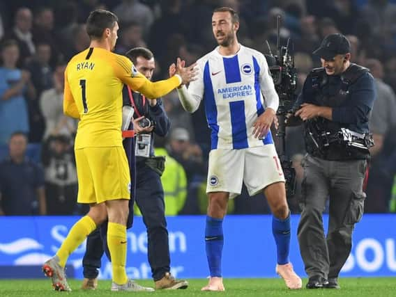 Mathew Ryan and Glenn Murray celebrate at the final whistle. Picture by PW Sporting Photography