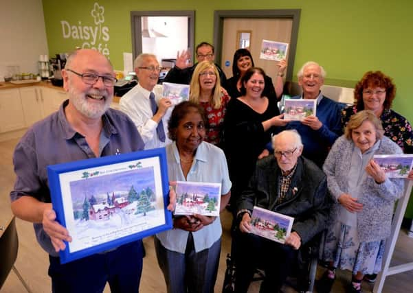 ks180500-1 Sage House Christmas Card  phot kate

The Christmas card was unveiled at Sage House in Tangmere. David Shannon, volunteer art tutor, left, with members of the Painting for Fun group.ks180500-1. SUS-180910-203316008