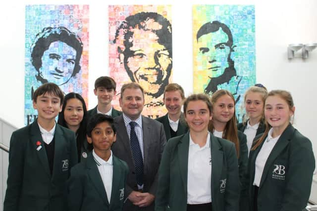 Headteacher Adam Whitehead with Bohunt pupils SUS-181210-122011001