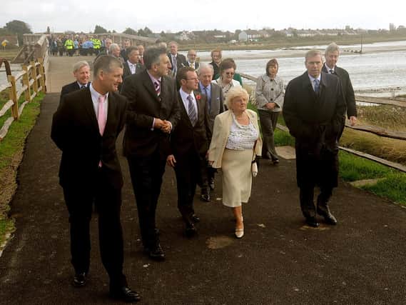 Liza McKinney leads Prince Andrew across the newly restored toll bridge in Shoreham