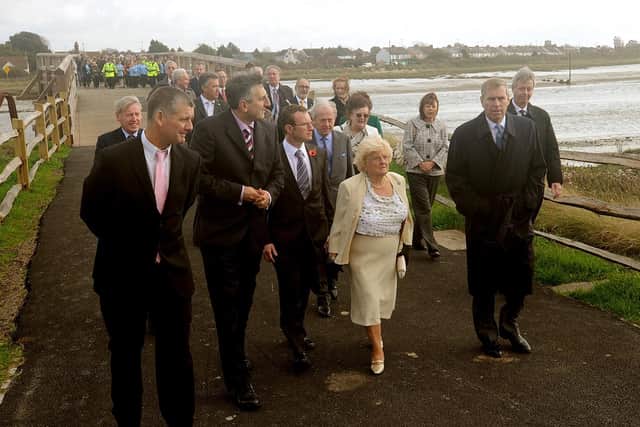 Liza McKinney leads Prince Andrew across the newly restored toll bridge in Shoreham