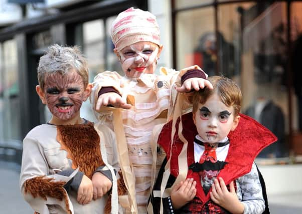 Halloween Party day in the Carfax organised by Horsham District Council with the Rotary Club of Horsham, Horsham Urban Children & Family Centre and local partners. Dylan Turner, Sophie Light and Alfie Turner.  Pic Steve Robards SR1632262 SUS-161027-170726001