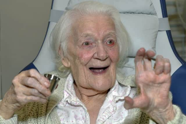 Florence Boulton known as Ronnie celebrates her 100th birthday at Woodside Hall nursing home. Photograph by Jon Rigby (SUS-181015-114609008)