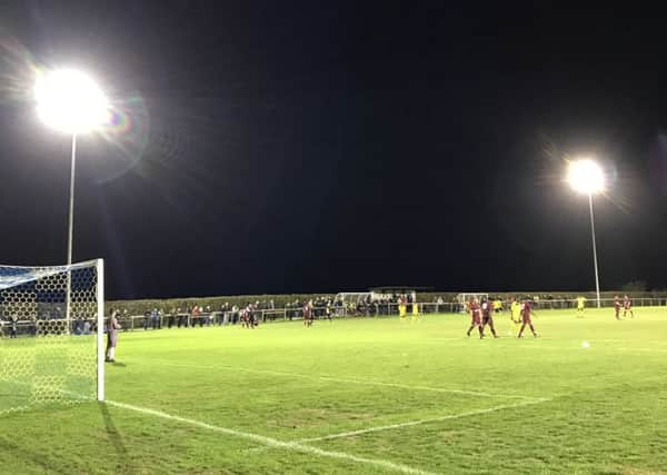 Action from Alfold's first-ever competitive game under floodlights on Tuesday night