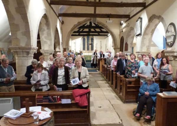 The congregation turned to look at the new Peace Window as the Bishop of Horsham made the dedication