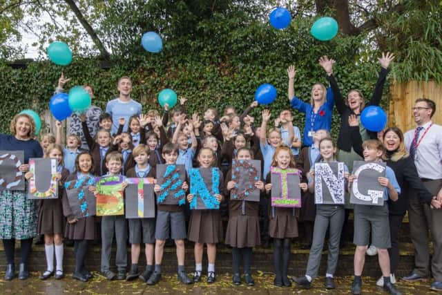 Pupils and staff at Blackthorns Community Primary in Lindfield celebrating