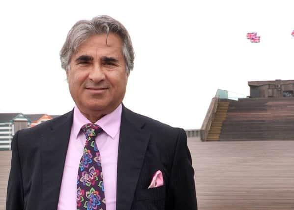 Sheikh Abid Gulzar pictured with Hastings Pier