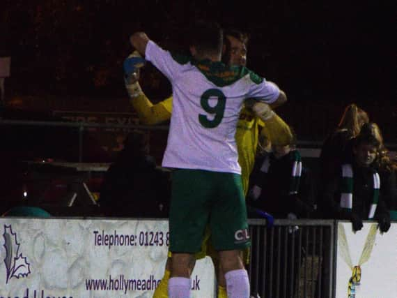 Brad Lethbridge congratulates Dan Lincoln on his penalty heroics / Picture by Darren Crisp