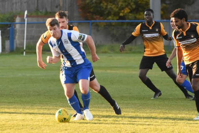 Byron Napper leaves the Cray players in his wake. Haywards Heath Town v Cray Wanderers. Picture by Grahame Lehkyj